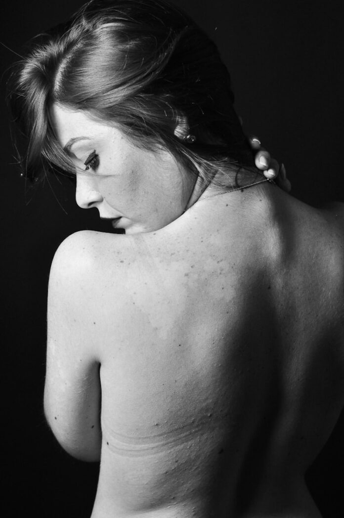 Photo by Emiliano Vittoriosi grayscale photo of topless woman