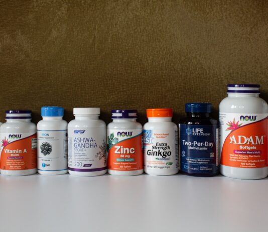 영양 가득한 한 끼, 스마트하게 챙기는 보충제 활용법 a row of bottles of different types of vitamins
