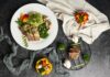 집밥 식단의 건강 트렌드, 나만의 ‘하루 한 끼 건강하게’ 실천법 a white plate topped with meat and veggies