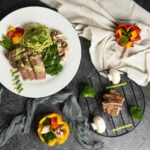 집밥 식단의 건강 트렌드, 나만의 ‘하루 한 끼 건강하게’ 실천법 a white plate topped with meat and veggies