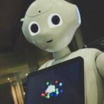 일상에 스며든 AI 건강 관리…작은 습관부터 실천이 열쇠 white robot toy holding black tablet